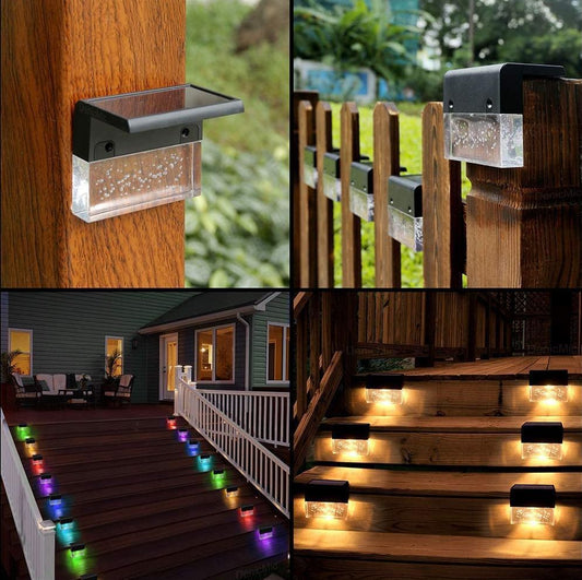 Outdoor steps and posts with low-level decorative lighting arranged in a consistent pattern