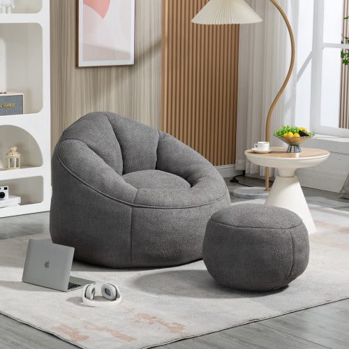 Soft lounge chair arranged in a reading nook with warm neutral styling