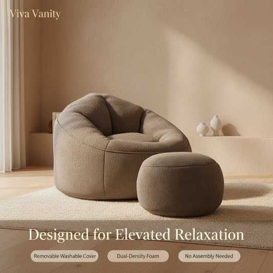 Gray foam bean bag lounge chair with matching footrest in a neutral living room