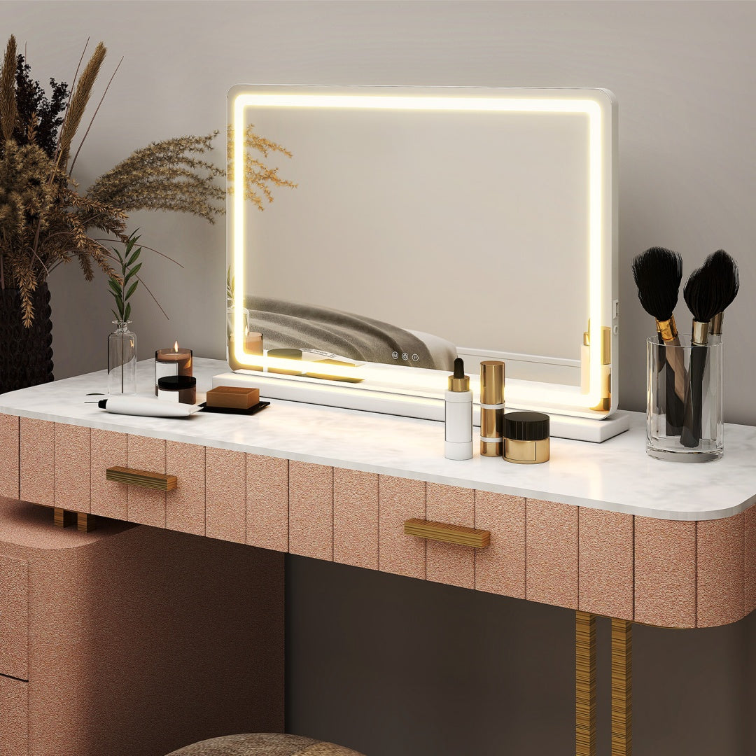 Lighted vanity mirror on a makeup table in a bedroom setting