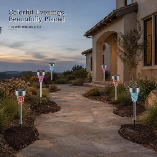 Solar courtyard stake lights set of six in a colorful evening garden