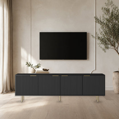 Black fluted TV stand with gold-tone legs in a balanced modern living room