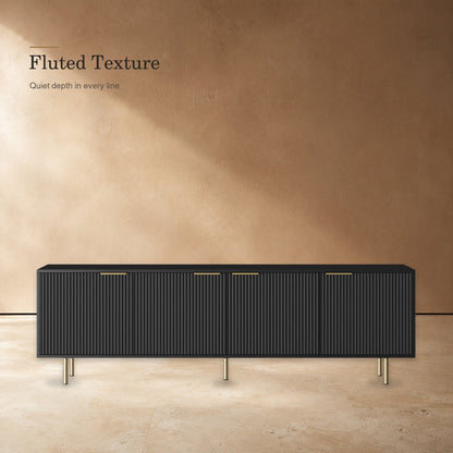 Black TV stand highlighting fluted door texture and gold-tone accents