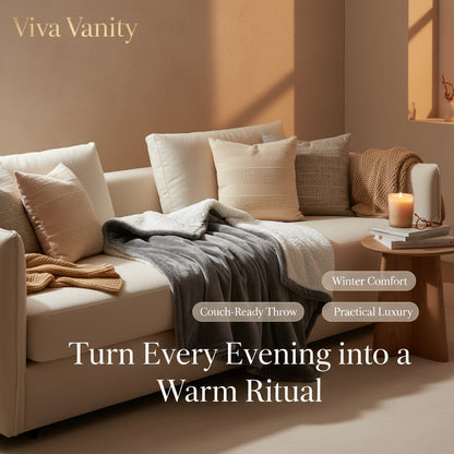 Gray electric blanket with two remote controls on a white background
