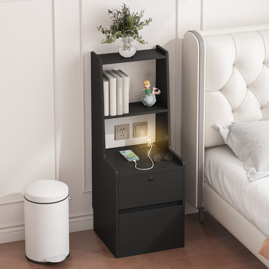 Black nightstand with drawers next to a bed in a bedroom setting.