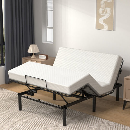 An adjustable bed base frame with a white mattress on a queen-sized bed, featuring a black metal frame and dual USB A+C ports, in a modern bedroom setting.