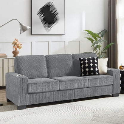 A contemporary style Viva Smart Corduroy 3-Seater Fabric Sofa in a modern living room setting with a gray cushioned backrest and seat, accompanied by decorative pillows, a coffee table, and wall art in the background.