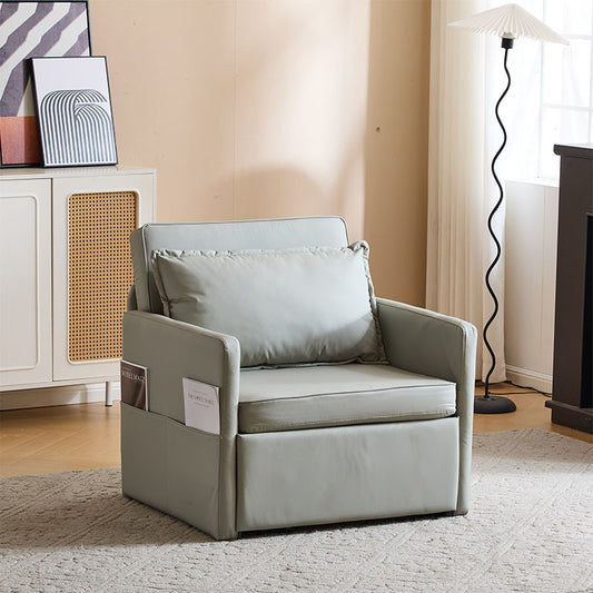 A gray microfiber sleeper chair with a steel frame, pull-out bed mechanism, and integrated tray table, set in a room with a light decor.
