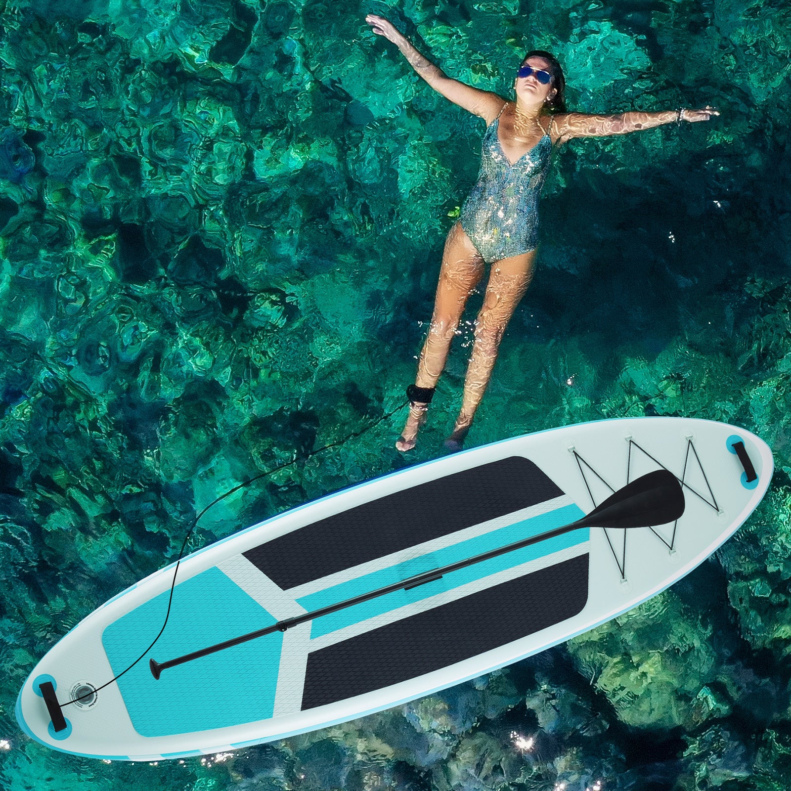 Woman floating above a paddleboard in clear turquoise water
