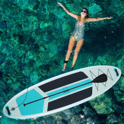 Woman floating above a paddleboard in clear turquoise water