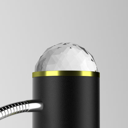 Black faucet handle with crystal top on a gray background