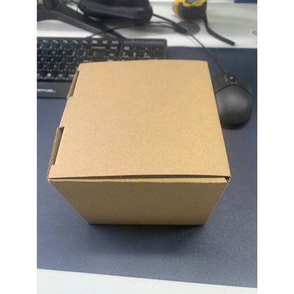 Brown cardboard box on a desk with a keyboard and mouse in the background