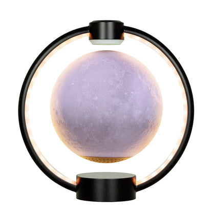 A levitating blue moon lamp with a 3D printed surface, surrounded by a circular LED light, mounted on a wooden base.