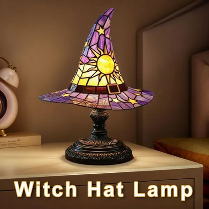 Stained-glass-style witch hat accent lamp with celestial sun and star details