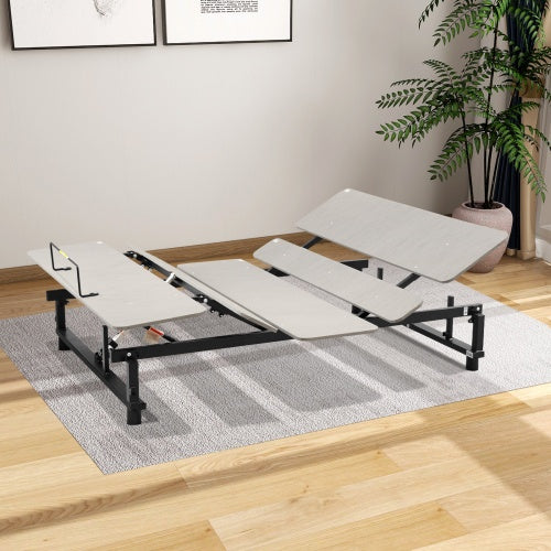 An electric adjustable bed base in a raised position, showcasing the head and foot incline features, with a wireless remote control placed on the mattress.