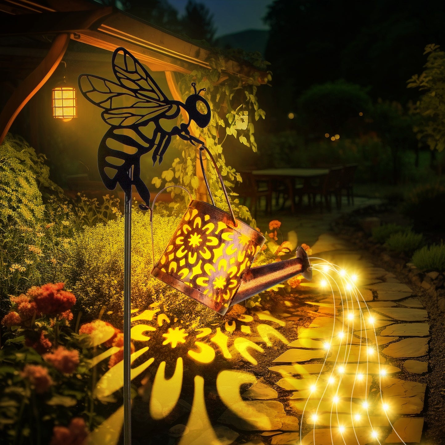 Decorative garden light with bee design and string lights in a garden setting