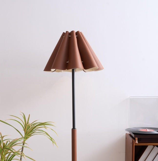 Floor lamp with a brown shade in a room setting