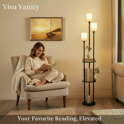 Living room with a floor lamp, books, and a couch with 'Viva Vanity' branding.