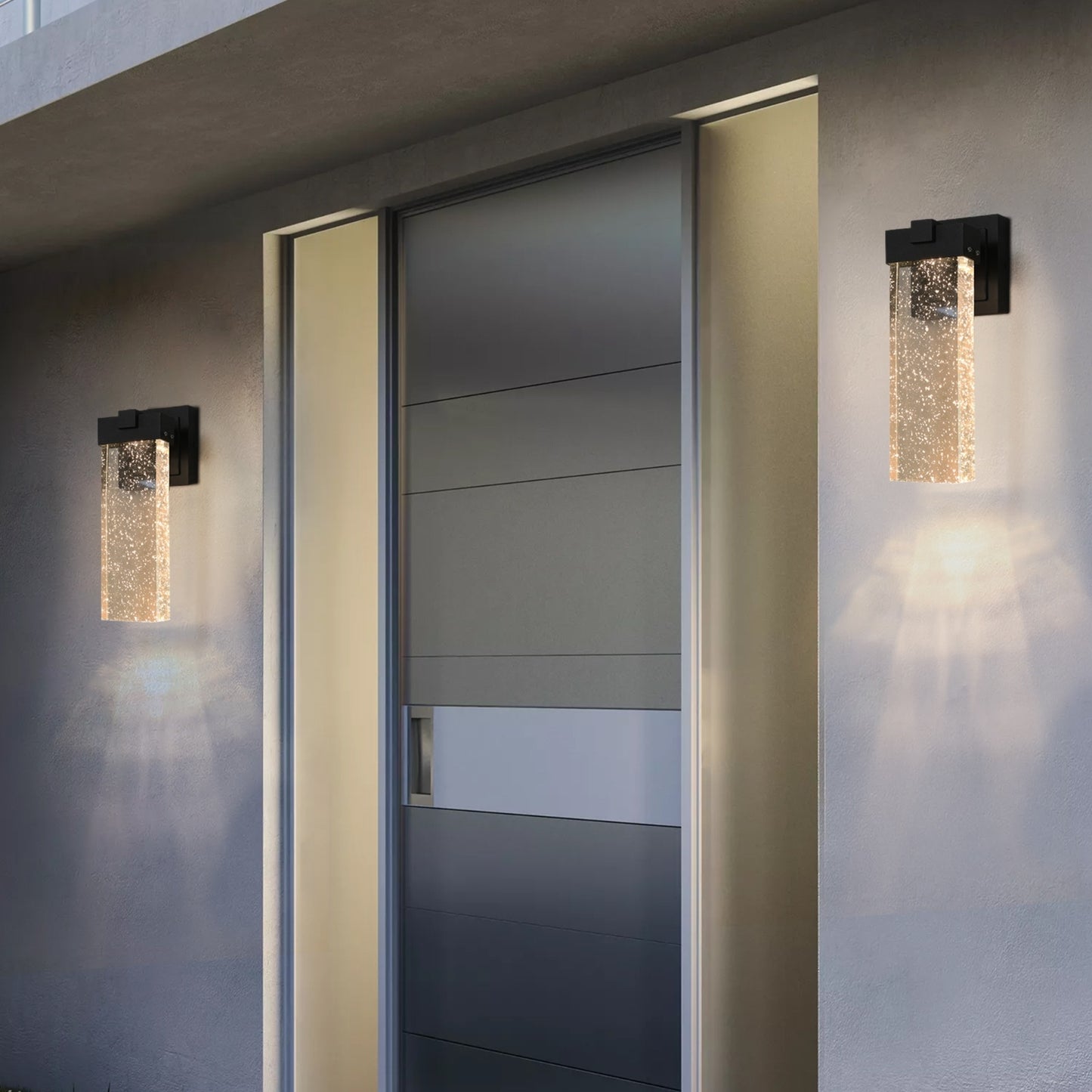 Modern wall lights on a building exterior with a door in the background