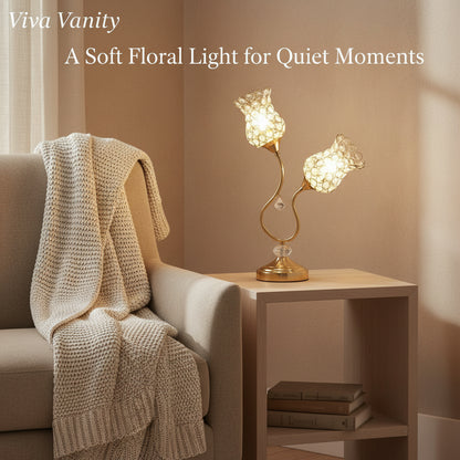 Decorative lamp on a side table next to a sofa with a blanket, featuring 'Viva Vanity' branding.