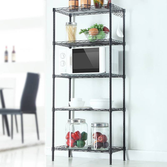 A matte black carbon steel storage rack with five shelves, displaying kitchen items like a microwave, jars, and a bowl.