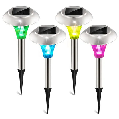 Four solar-powered garden lights with colorful LED lights on a white background