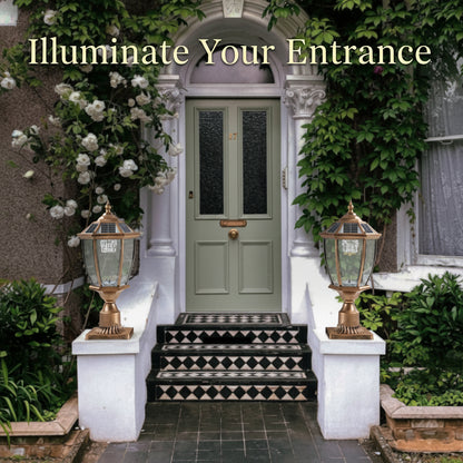 Green door with decorative lamps and steps leading up to it
