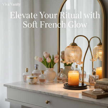 Decorative table lamp with a glass shade and candle base, set against a blurred indoor background.