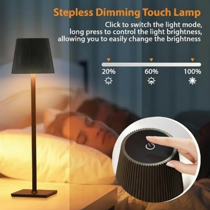 Stepless dimming touch lamp with control knob and light mode indicator on a blurred bedroom background.
