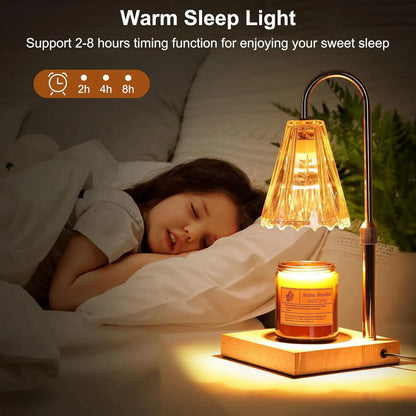 Child sleeping in bed with a warm sleep light and candle on a nightstand.