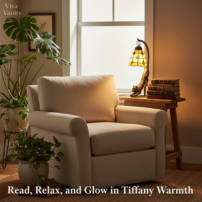 Decorative lamp shaped like a cat with stained glass shade on a dark background