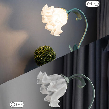 Decorative wall lamp with floral design on a dark background