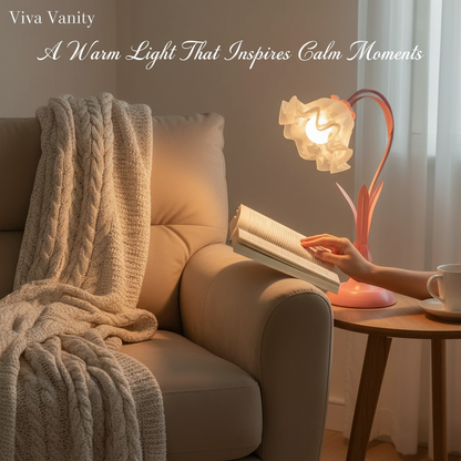 Cozy living room scene with a person reading a book next to a pink lamp and a cup of coffee.
