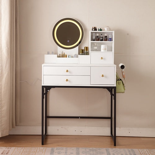 A white vanity desk with a lighted oval mirror, multiple drawers, and a black iron bracket support, placed against a neutral background.