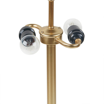 A dome-shaped 2-light metal table lamp with a sleek, curved shade, placed on a white table in a room with a minimalist decor 3