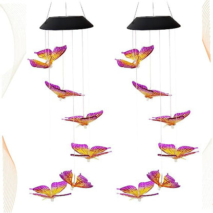 Butterfly-shaped solar lights hanging against a white background