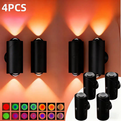 Set of black outdoor lights with color-changing feature on a white background