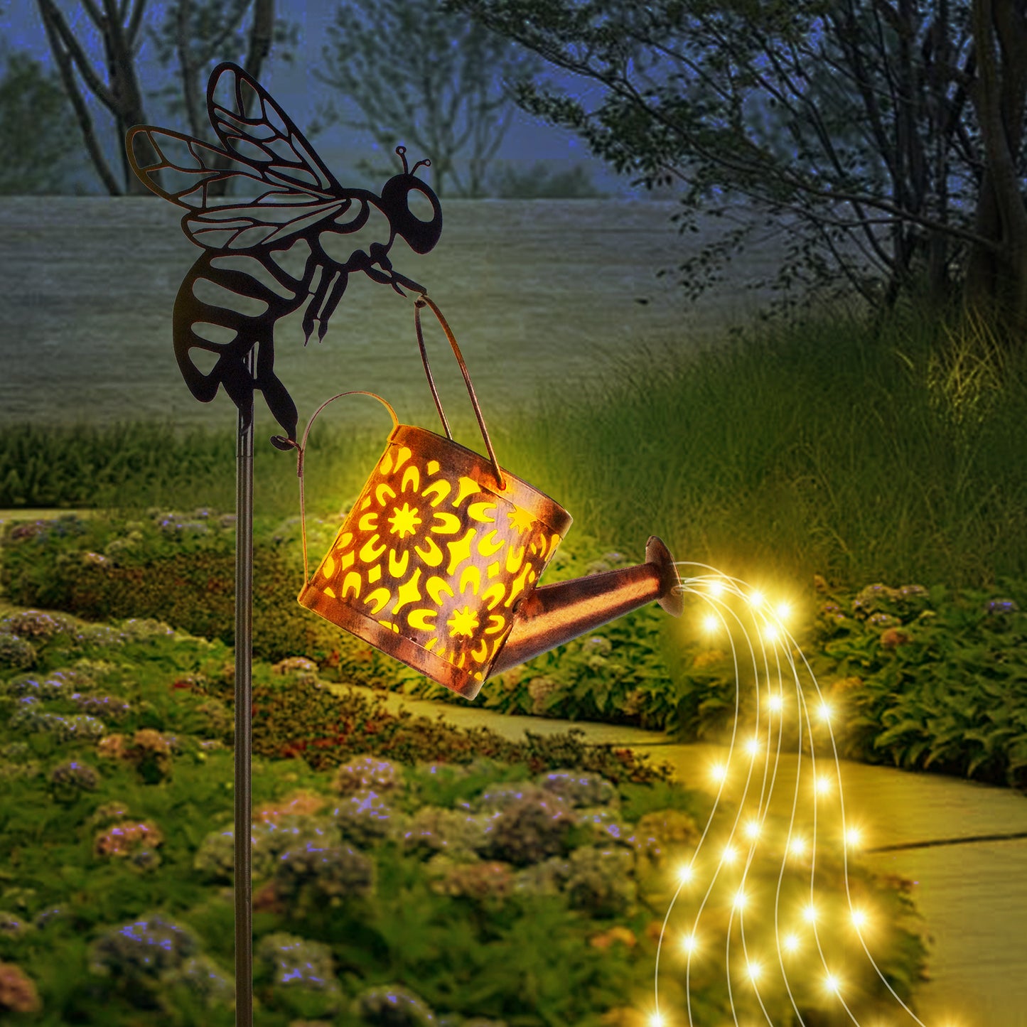 Solar garden light shaped like a bee with a lantern and string lights in a garden setting.