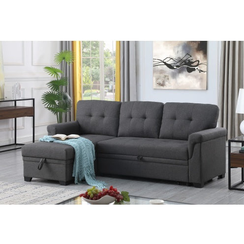 A reversible sleeper sectional sofa in a dark gray linen upholstery, with a storage compartment and a drop-arm console with USB charging ports, placed in a modern living room setting.