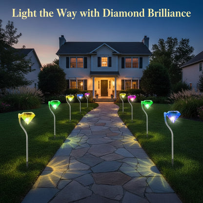 Four colorful diamond-shaped solar lights on stakes against a white background