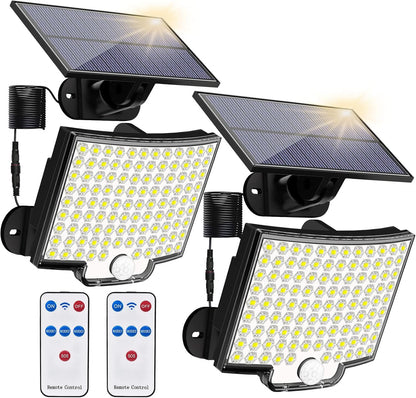 Solar-powered outdoor lights with remote controls on a white background