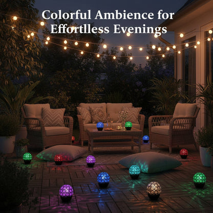 Outdoor patio with string lights and colorful floor lamps creating a cozy ambiance.