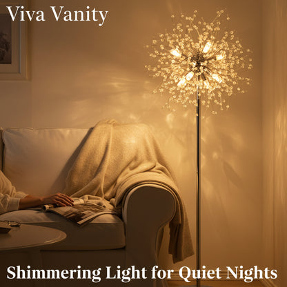 A 69-inch tall modern crystal floor lamp with a chrome finish, featuring 32 suspended crystal strands, illuminated and casting a warm glow in a room with a white sofa.