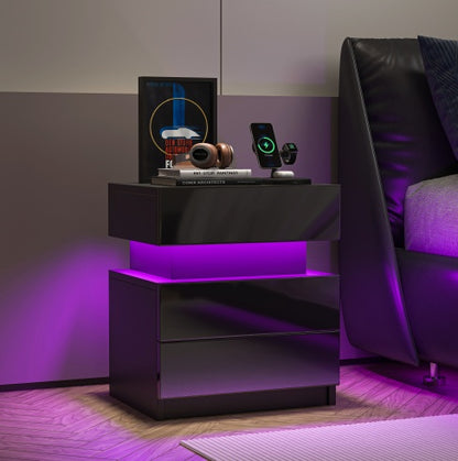black LED nightstand styled beside a bed