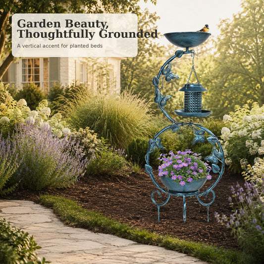 Antique Blue solar bird bath with feeder and planter styled in a garden bed