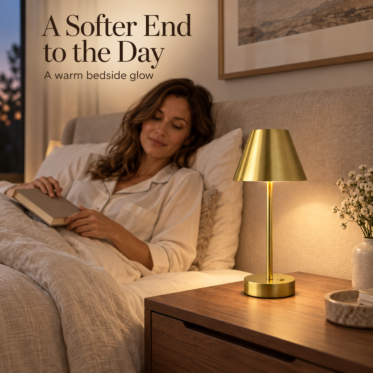 Rechargeable brass lamp on a walnut nightstand beside a woman relaxing with a book.