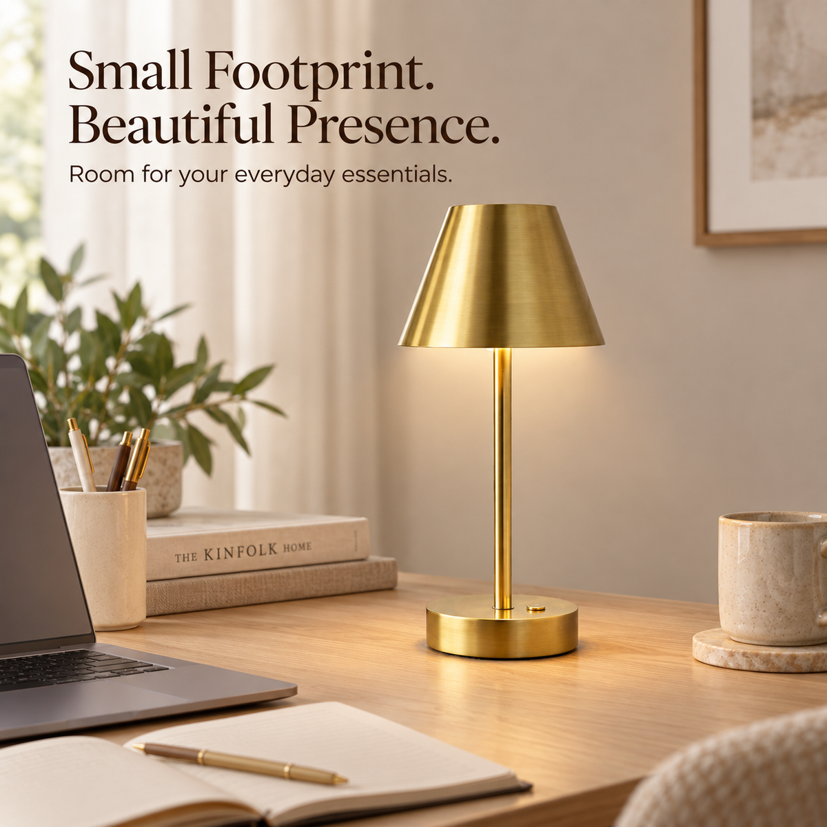 Compact brass LED table lamp on an oak desk beside a laptop and open notebook.