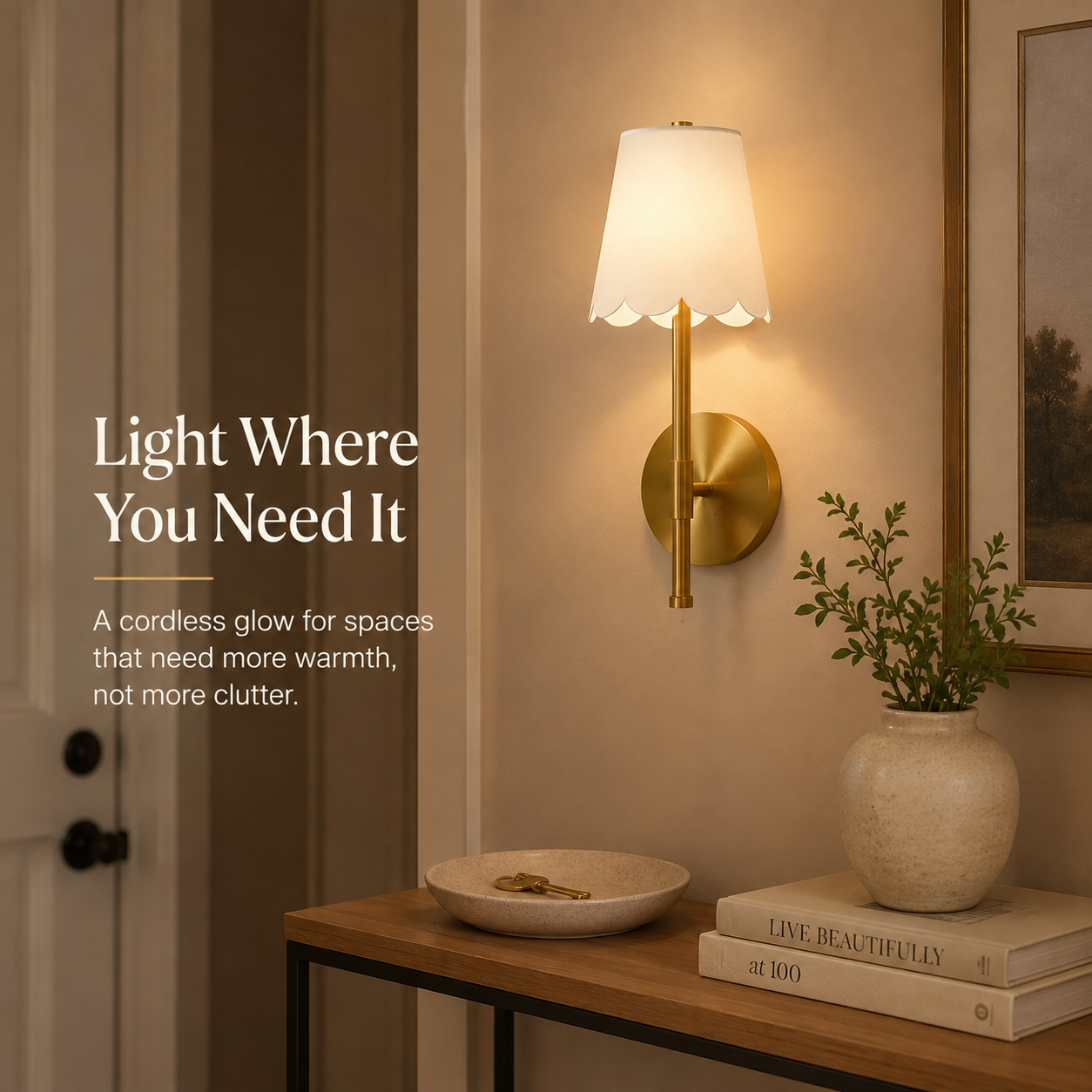 Cordless brass scalloped wall sconce adding warm light to a compact entryway