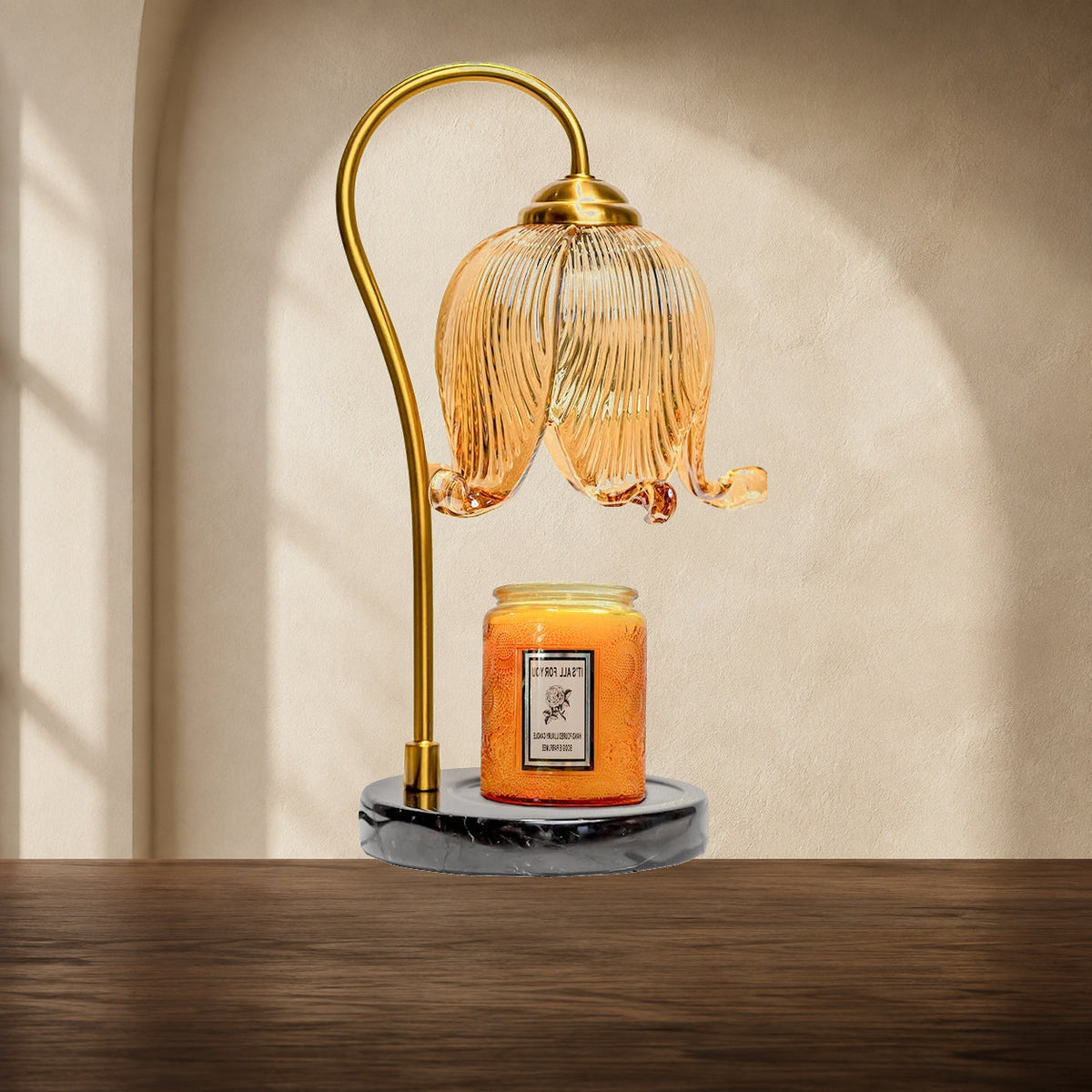 Full view of French tulip candle warmer lamp with gold arm and black round base