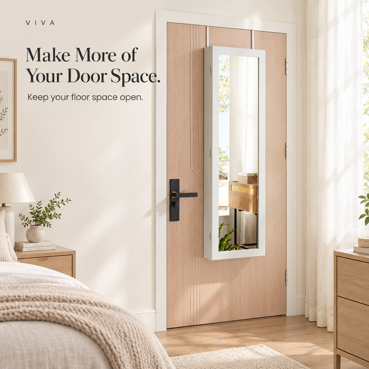 White mirrored jewelry cabinet mounted on a pale wood bedroom door, keeping the floor space open.